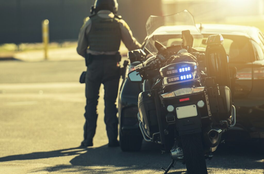 Motorcycle Police Officer Giving Traffic Ticket